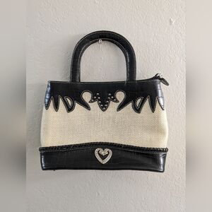 Cream and black similar to brighton purses